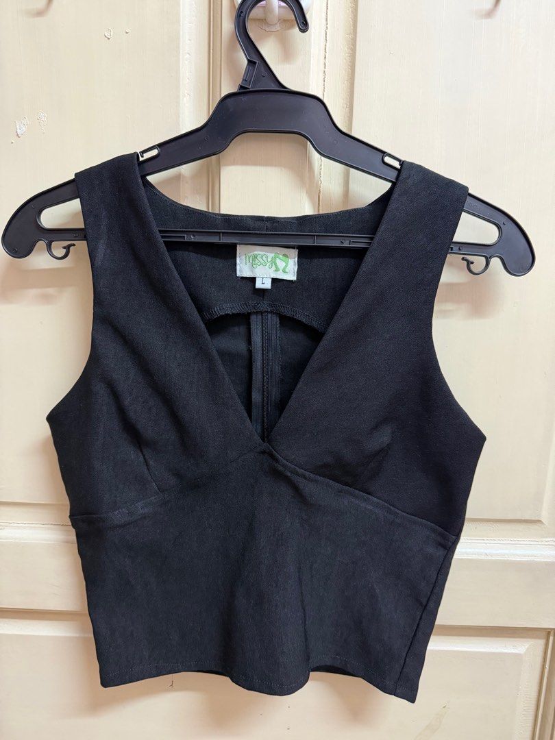 Missym Black V neck Sleeveless Top (Category: Sleeveless) located in Manila. Submitted by tltdeclutters (Listing ID 1415808470, Image 1). Description: - Worn only once - Stretchable - Zipper on the back - Good condition - Payment method: GCASH or BPI.