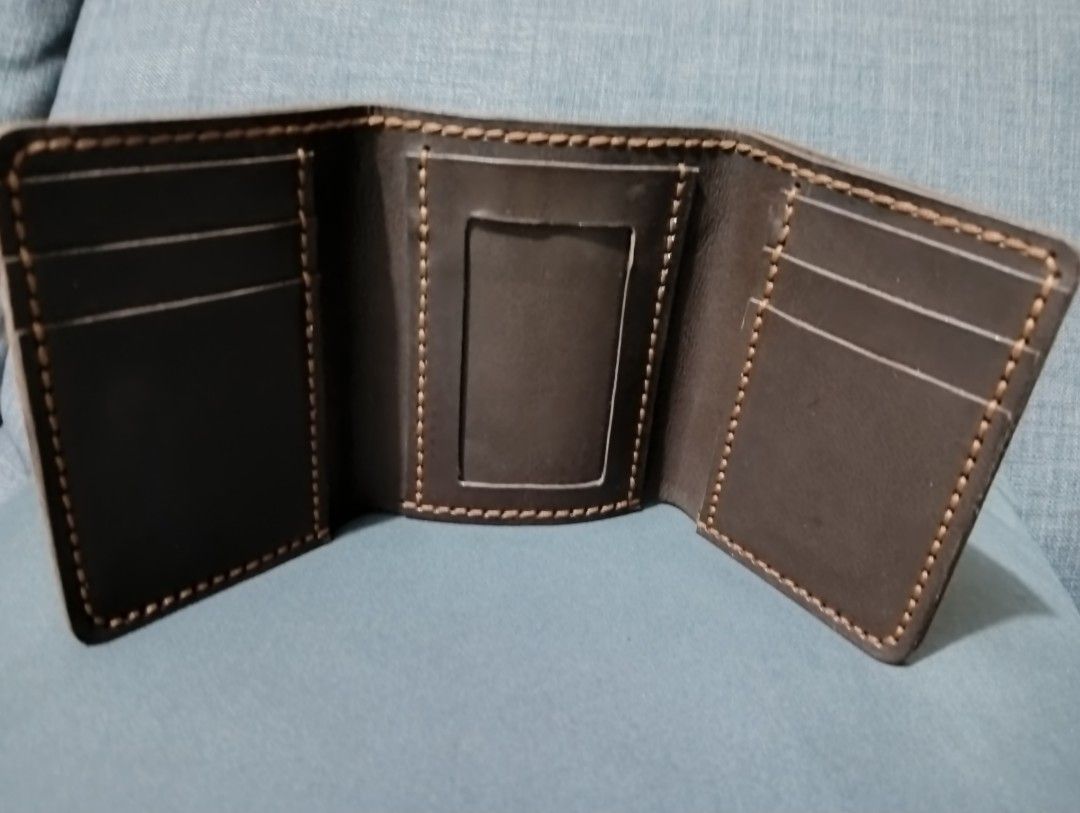 Mugna Handmade Genuine Leather Trifold Wallet (Category: Wallets & Card Holders) located in Hermosa. Submitted by chic2315 (Listing ID 1415810027, Image 1). Description: Mugna Leather Arts Genuine Leather trifold Wallet. It has 1 ID slot and 6 card holder. Local made and handmade po ito. Like new condition, halos di man po nagamit. Very durable po ito. RFS: Too many wallets.