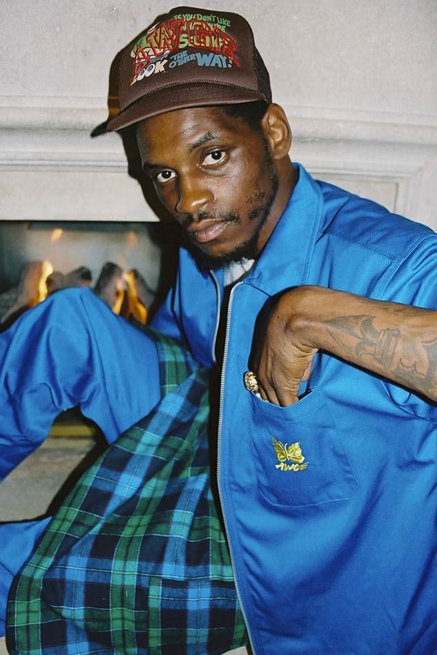 Needles - AWGE - F/W 21 - Reversible Work Jacket (Category: Coats, Jackets and Outerwear) located in Manila. Submitted by graymatter_ (Listing ID 1415703156, Image 1). Description: Needles - AWGE - F/W 21 - Reversible Work Jacket Reversible long sleeve cotton twill jacket in black. Spread collar. Zip closure with detachable logo hardware pull-tabs at front. Flap pocket with embroidered logo in yellow at chest. Welt pockets at waist. Single-button