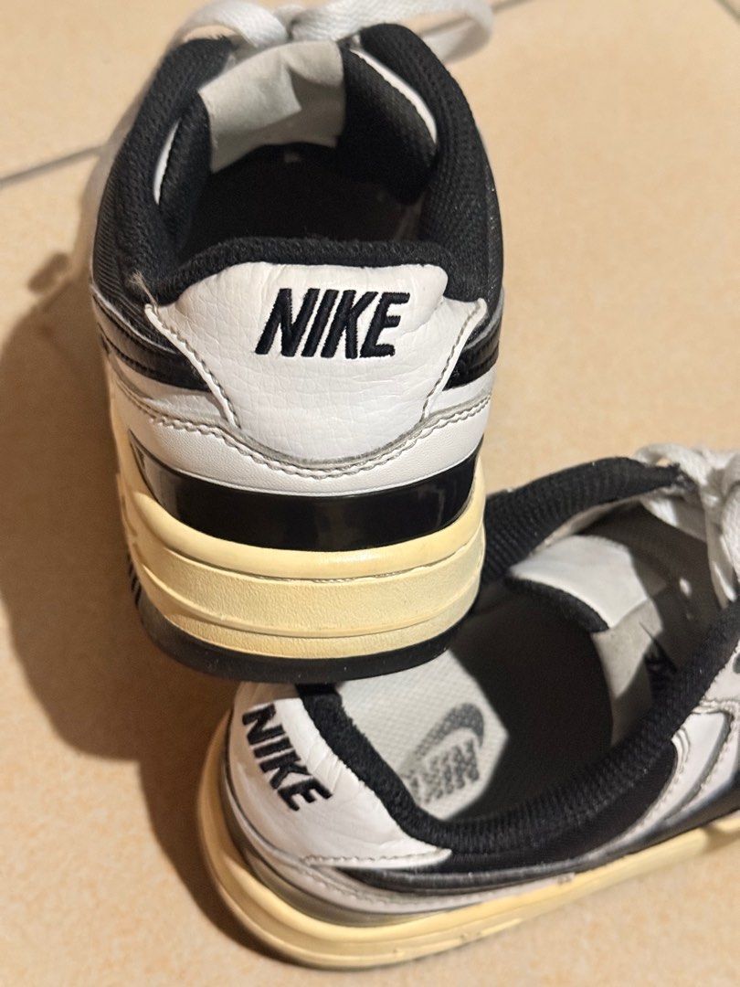 Nike Court Vision Low Sneakers (Category: Sneakers) located in Quezon City. Submitted by jazsolian (Listing ID 1415749566, Image 2). Description: - Nike Court Vision Low sneakers - Color: White with black accents - Nike logo on the side - "NIKE" branding on the heel - Cream-colored soles - White laces, black interior.