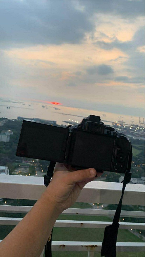 Nikon D5300 DSLR Camera with Lenses (Category: Cameras) located in Cabuyao City. Submitted by apage2328 (Listing ID 1415689703, Image 3). Description: - Nikon D5300 DSLR camera - Includes SIGMA lenses with lens caps - Comes with camera bag and strap - Includes a tripod - In good working condition - Perfect for photography enthusiasts.