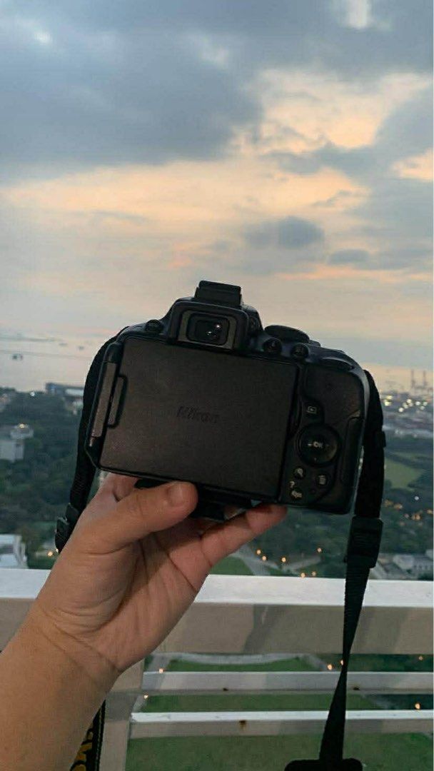 Nikon D5300 DSLR Camera with Lenses (Category: Cameras) located in Cabuyao City. Submitted by apage2328 (Listing ID 1415689703, Image 2). Description: - Nikon D5300 DSLR camera - Includes SIGMA lenses with lens caps - Comes with camera bag and strap - Includes a tripod - In good working condition - Perfect for photography enthusiasts.