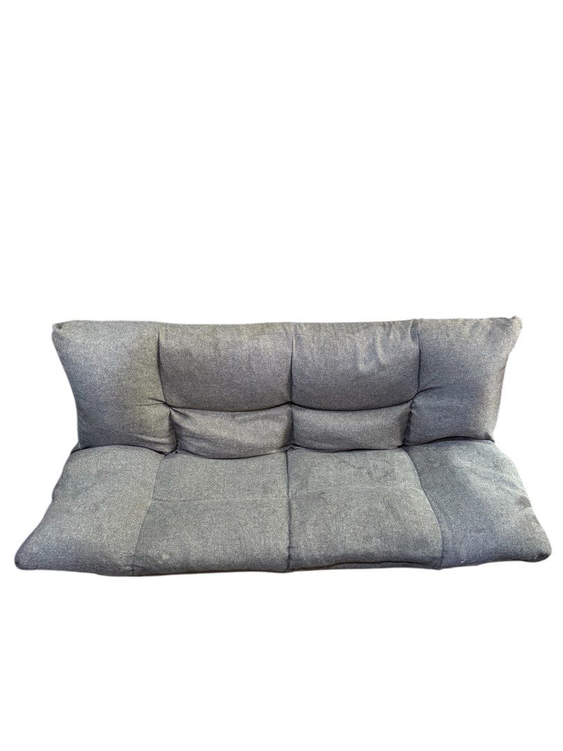 NITORI Floor Sofa Bed 54x42 inches (Category: Sofas) located in Quezon City. Submitted by mikesiawingco (Listing ID 1415758007, Image 3). Description: - NITORI floor sofa bed - Color: Gray - Folds flat for easy storage - Dimensions: 54x42 inches - Features a cushioned backrest - Includes armrests - Made with textured fabric.