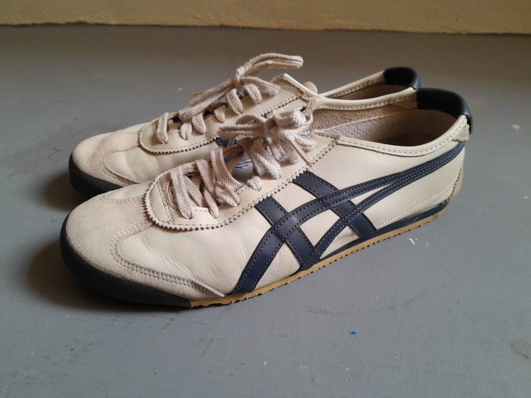 Onitsuka Tiger MEXICO 66 Birch/Peacoat Sneakers (Category: Sneakers) located in Singapore. Submitted by reich (Listing ID 1415643983, Image 1). Description: AI Overview This is a pair of Onitsuka Tiger Mexico 66 sneakers in the "Birch/Peacoat" colorway, featuring a leather upper with suede overlays and a rubber sole. Classic Onitsuka Tiger MEXICO 66 NM sneakers in Birch/Peacoat colorway. Features a leather upper with suede toe cap. Size is 27.5 C