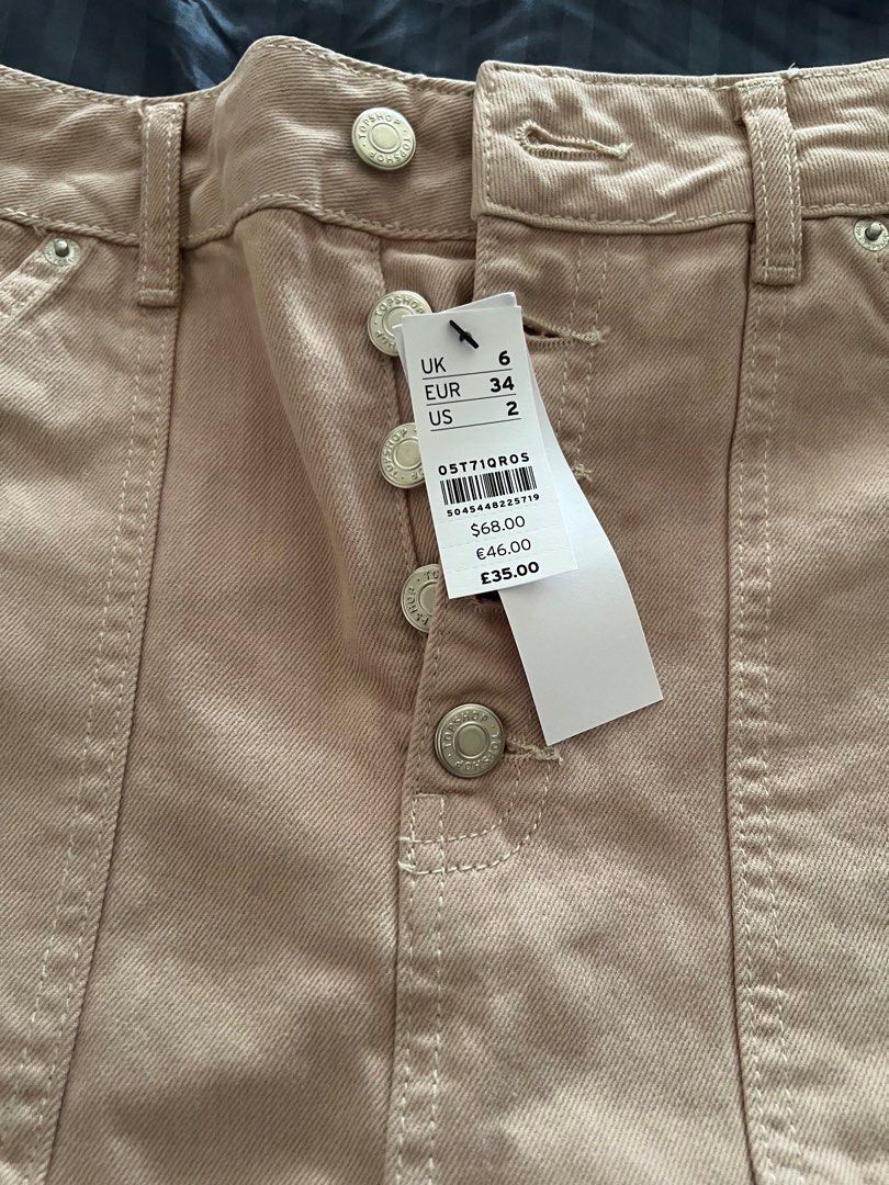 Original Top Shop skirt (Category: Skirts) located in Quezon City. Submitted by tangled8 (Listing ID 1415637611, Image 2). Description: Original Top shop bought in London size 26" length 33" with slit. Color Salmon, brand new..