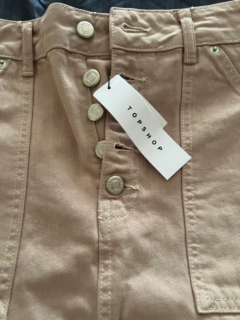 Original Top Shop skirt (Category: Skirts) located in Quezon City. Submitted by tangled8 (Listing ID 1415637611, Image 3). Description: Original Top shop bought in London size 26" length 33" with slit. Color Salmon, brand new..