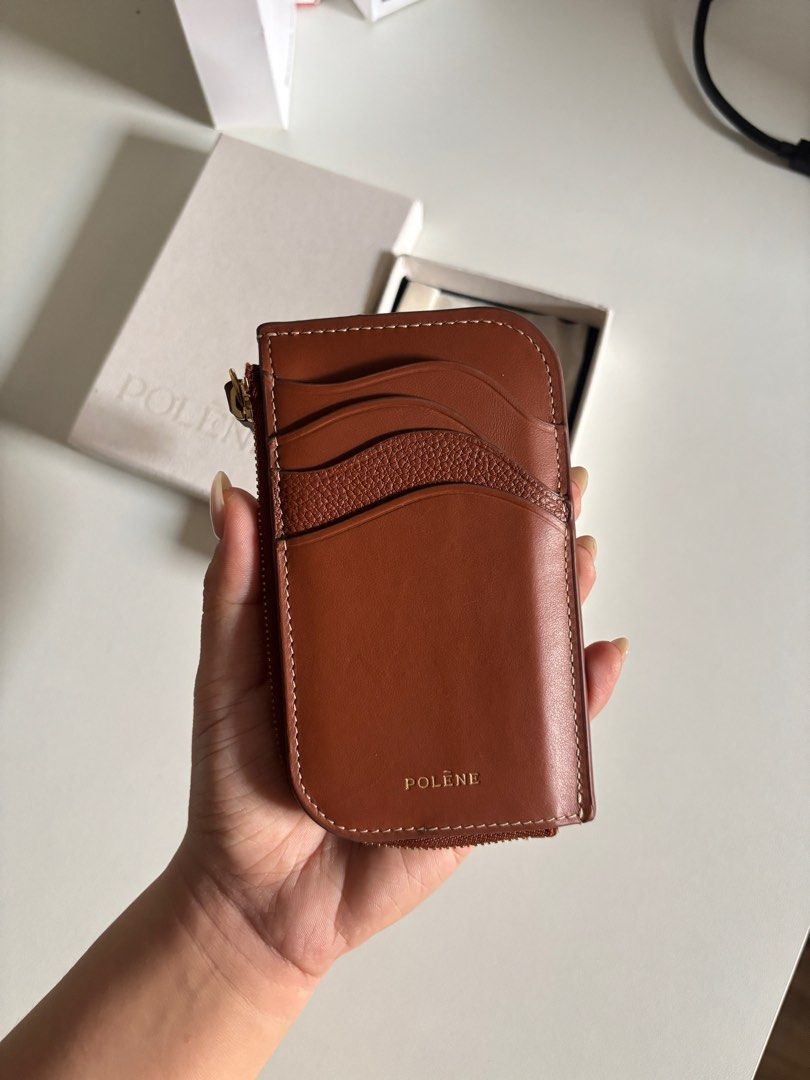AUTHENTIC Polene Card Holder Wallet Atla Brown (Category: Luxury Bags & Wallets) located in Bay. Submitted by _deiclutter (Listing ID 1415648239, Image 3). Description: - Brown leather - Zip closure - Unique front design - Polène logo on the back - Comes with original box and packaging Super good condition, rare find Lalamove and jnt 📍los banos/bay/calamba .