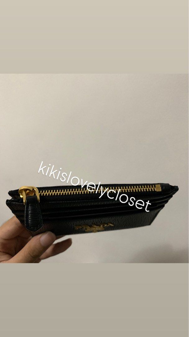 Prada Vitello Move Card Holder Wallet in Black (Category: Luxury Bags & Wallets) located in Manila. Submitted by kikislovelycloset (Listing ID 1415641947, Image 3). Description: - never used - Prada Vitello Move Card Holder Wallet - Color: Black - Features card slots and a zippered compartment, gold accents - full inclusions with Prada box, receipt, authenticity card - Pasay City near MOA. Delivery fee must be shouldered by buyer .