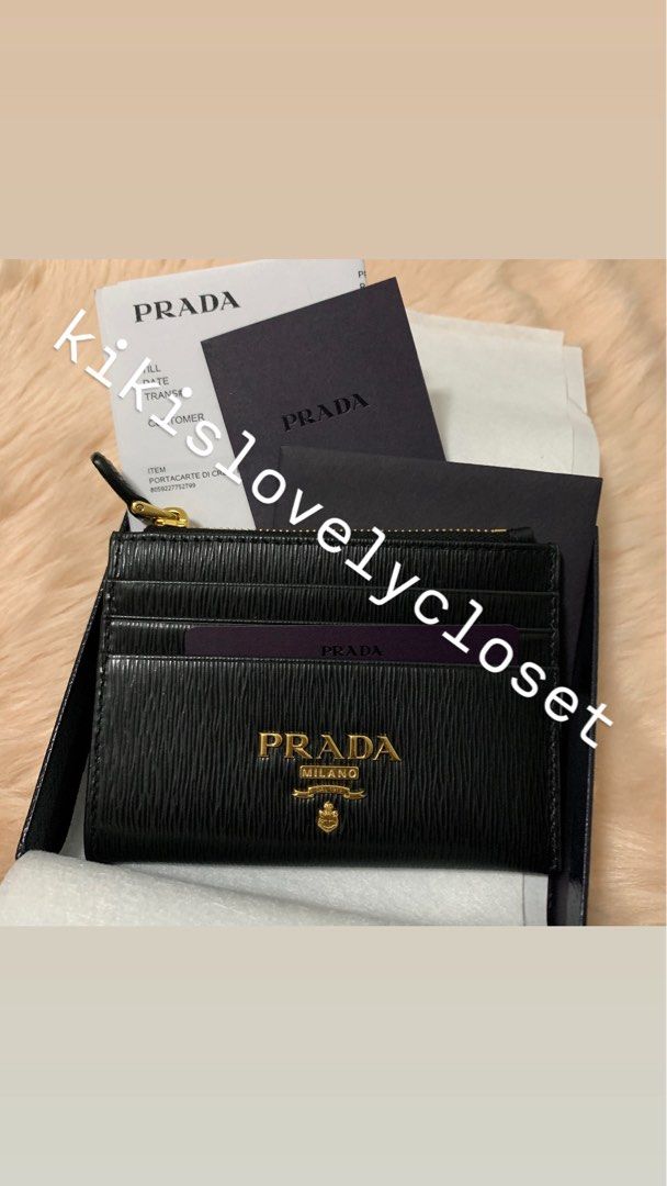 Prada Vitello Move Card Holder Wallet in Black (Category: Luxury Bags & Wallets) located in Manila. Submitted by kikislovelycloset (Listing ID 1415641947, Image 1). Description: - never used - Prada Vitello Move Card Holder Wallet - Color: Black - Features card slots and a zippered compartment, gold accents - full inclusions with Prada box, receipt, authenticity card - Pasay City near MOA. Delivery fee must be shouldered by buyer .