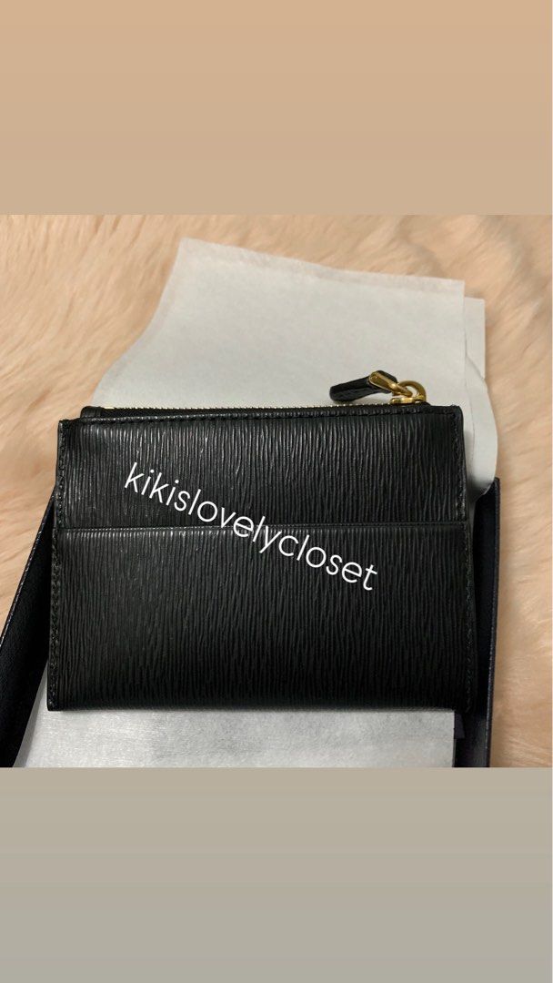 Prada Vitello Move Card Holder Wallet in Black (Category: Luxury Bags & Wallets) located in Manila. Submitted by kikislovelycloset (Listing ID 1415641947, Image 2). Description: - never used - Prada Vitello Move Card Holder Wallet - Color: Black - Features card slots and a zippered compartment, gold accents - full inclusions with Prada box, receipt, authenticity card - Pasay City near MOA. Delivery fee must be shouldered by buyer .