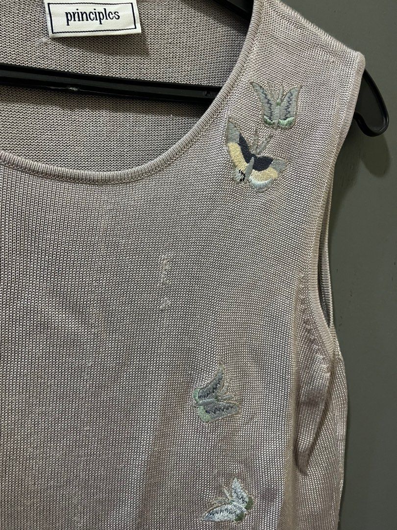 Principles Sleeveless Top with Embroidery (Preloved) (Category: Sleeveless) located in Quezon City. Submitted by ntryv (Listing ID 1415812080, Image 3). Description: DETAILS - Principles sleeveless top - Unique embroidered design 🦋 - Scoop neckline - Scalloped hem - Neutral color - Lightweight knit material - Plain back - Ideal for warm weather - Good to M-L pictures are captured with and without flash Mix & match: Buy any 2 items priced at ₱30 