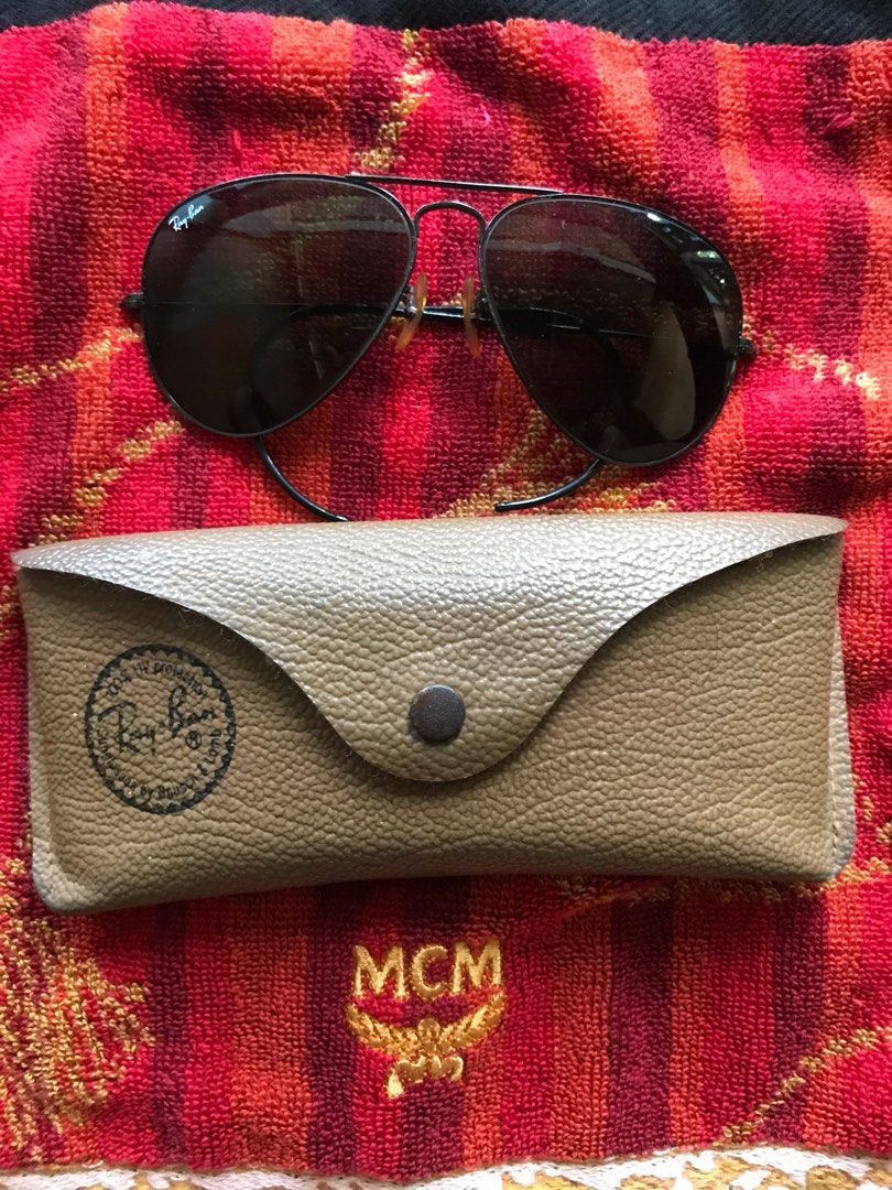 Ray-Ban Aviator Sunglasses (Category: Sunglasses & Eyewear) located in Manila. Submitted by jedthrift21 (Listing ID 1415747005, Image 1). Description: - Classic Ray-Ban Aviator sunglasses - Black frame - Dark lenses - Includes original tan Ray-Ban case.