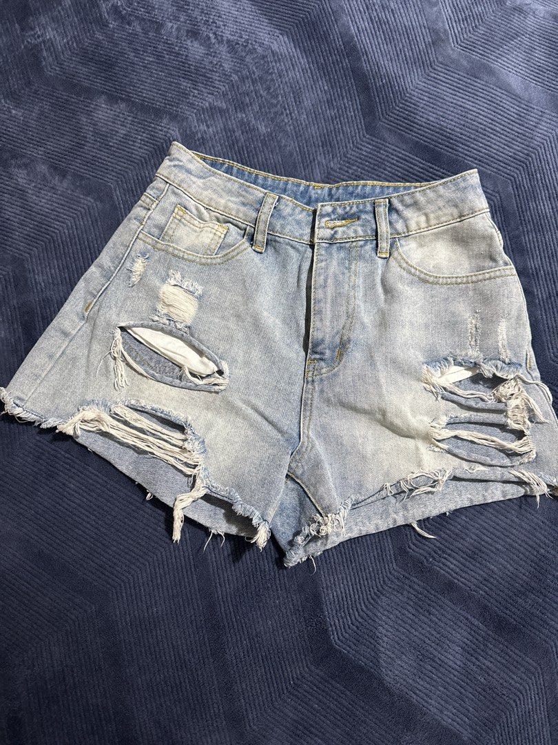 SHEIN Distressed Denim Shorts XS (Category: Shorts) located in Baguio. Submitted by tamarands (Listing ID 1415727422, Image 1). Description: - SHEIN light wash denim shorts - Distressed design with rips and frayed edges - Classic five-pocket styling - Button and zipper closure - Size XS.