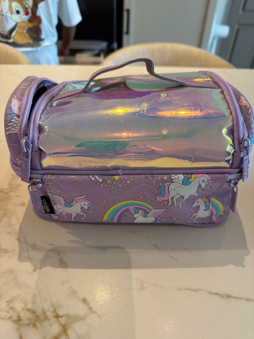 Smiggle Unicorn Double Decker Lunchbox (Category: Babies & Kids Fashion) located in Singapore. Submitted by sammy_quach (Listing ID 1415654756, Image 2). Description: - Adorable Smiggle lunchbox with unicorn and rainbow design. - Features two compartments for food separation. - Insulated to keep food fresh. - Ideal for school or picnics!.