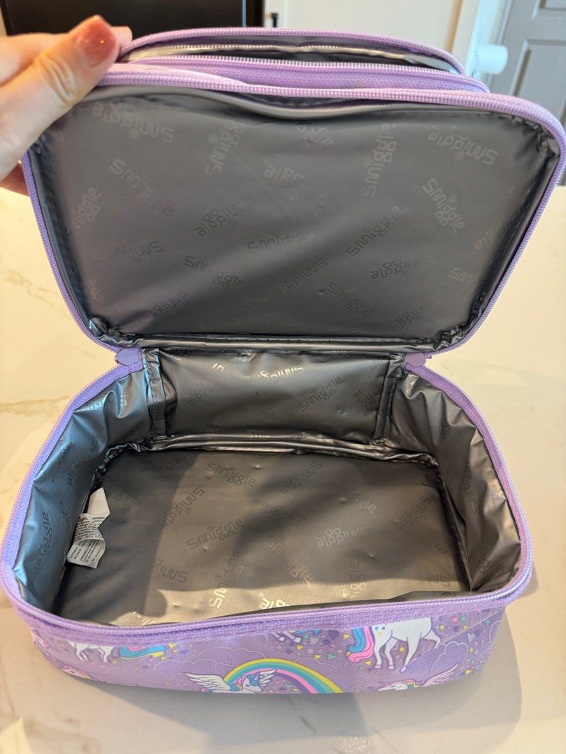 Smiggle Unicorn Double Decker Lunchbox (Category: Babies & Kids Fashion) located in Singapore. Submitted by sammy_quach (Listing ID 1415654756, Image 3). Description: - Adorable Smiggle lunchbox with unicorn and rainbow design. - Features two compartments for food separation. - Insulated to keep food fresh. - Ideal for school or picnics!.