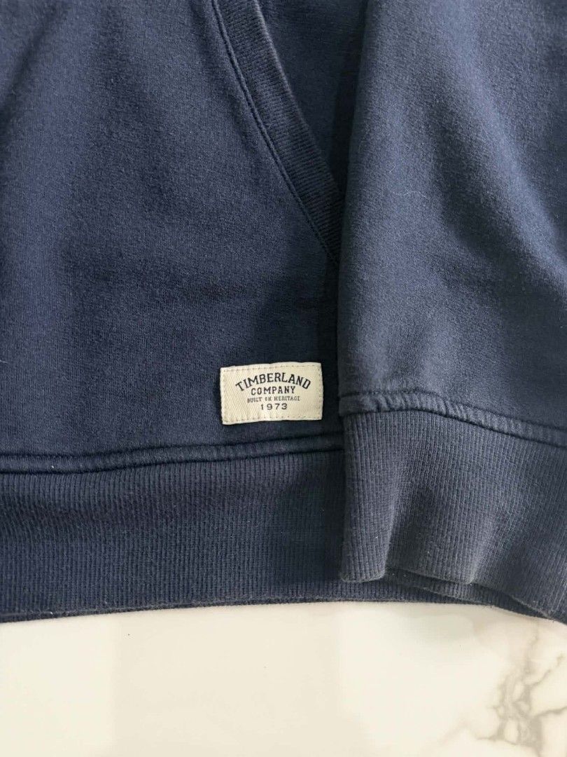 Timberland Navy Blue Hoodie (Category: Hoodies) located in Tayug. Submitted by thriftppings (Listing ID 1415806727, Image 3). Description: - Timberland Navy Blue Hoodie - Bigtree logo on front - Complete Tags - Dimes: W24 x L28 - Condi: 9/10 - Color: 9/10 - Comfortable Fit.