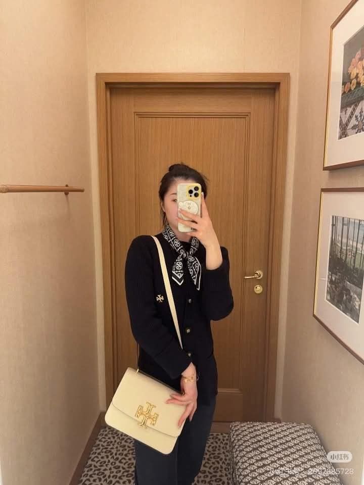 Tory Burch Kira Chevron Shoulder Bag (Category: Luxury Bags & Wallets) located in Manila. Submitted by santosrich_419 (Listing ID 1415783355, Image 1). Description: Tory Burch Kira Chevron shoulder bag features a gold-tone logo and a detachable shoulder strap. It has a flap closure and a spacious interior. The bag is available in multiple colors, including black, brown, and cream. The dimensions of the black bag are 24x16cm. It's a stylish and ve