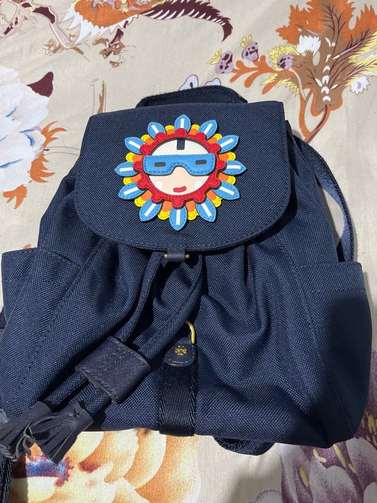 Tory Burch Limited Edition Classic Sunflower Backpack (Category: Luxury Bags & Wallets) located in Manila. Submitted by hi_abbd (Listing ID 1415798117, Image 1). Description: Used only once so hard to let go since this is a limited edition. Can fit quite a lot of a mini backpack Has a small stain on the flap see 9th photo. I think this can be washed but if not its not visible so its fine.