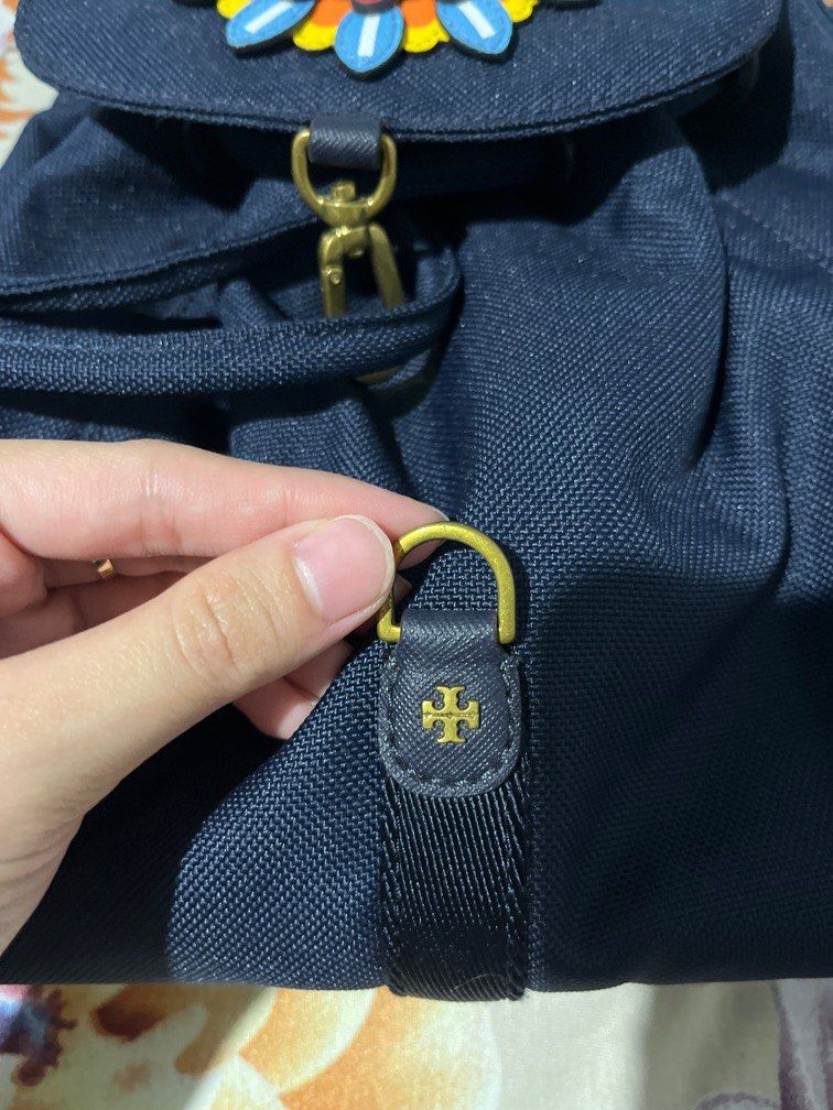 Tory Burch Limited Edition Classic Sunflower Backpack (Category: Luxury Bags & Wallets) located in Manila. Submitted by hi_abbd (Listing ID 1415798117, Image 2). Description: Used only once so hard to let go since this is a limited edition. Can fit quite a lot of a mini backpack Has a small stain on the flap see 9th photo. I think this can be washed but if not its not visible so its fine.