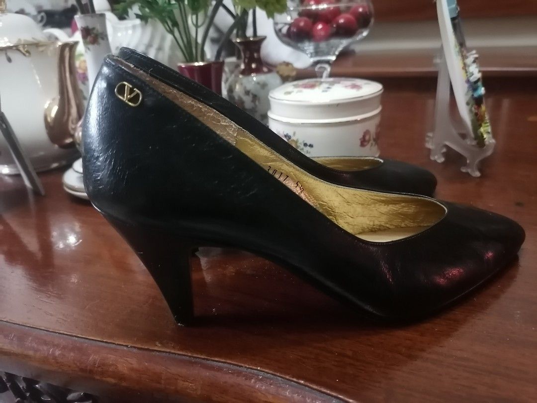 Valentino Garavani Black Heels (Category: Heels) located in Las Pinas. Submitted by sherryfied (Listing ID 1415686333, Image 3). Description: - Valentino Garavani black heels - Size: 5.5 - Iconic 'V' logo detail - Pointed toe design - Moderate heel height - yellow gikd hardware still intact - Made in Japan .