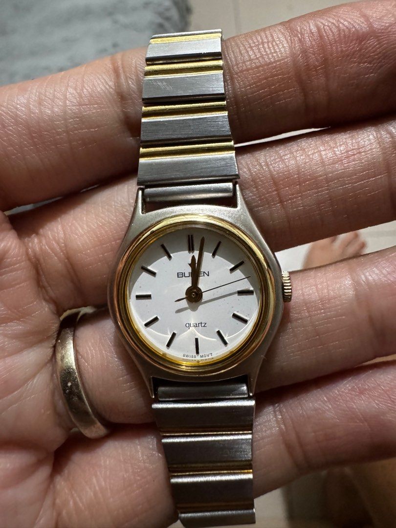 Vintage Buren Quartz Watch (Category: Luxury Watches) located in Pasay City. Submitted by mydeer08 (Listing ID 1415796236, Image 3). Description: - Buren quartz watch - White dial with gold-tone bezel - Stainless steel band - Swiss movement - Back marked: "CW-BU-217340" - Clasp marked: "Stainless Steel" - 2 tone.