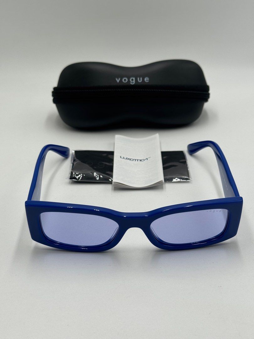 VOGUE EYE WEAR (Category: Luxury Accessories) located in Quezon City. Submitted by _cmluxephilippines (Listing ID 1415698851, Image 2). Description: Vogue Eyewear VO5584S model. They are a full-rim, rectangular style made from blue acetate with violet-tinted lenses. Product Details Feature Detail Brand Vogue Eyewear Model Number VO5584S Frame Color Full Blue / Solid Blue Lens Color Violet Frame Material Acetate Lens Material Polyamide Shape Recta