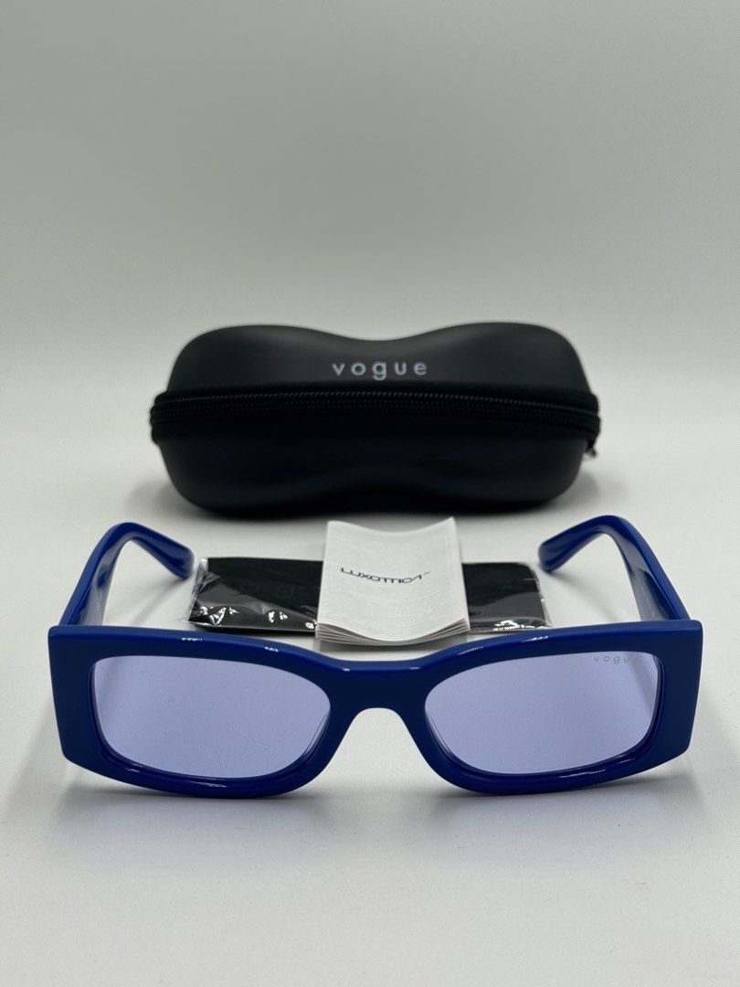 VOGUE EYE WEAR (Category: Luxury Accessories) located in Quezon City. Submitted by _cmluxephilippines (Listing ID 1415698851, Image 3). Description: Vogue Eyewear VO5584S model. They are a full-rim, rectangular style made from blue acetate with violet-tinted lenses. Product Details Feature Detail Brand Vogue Eyewear Model Number VO5584S Frame Color Full Blue / Solid Blue Lens Color Violet Frame Material Acetate Lens Material Polyamide Shape Recta