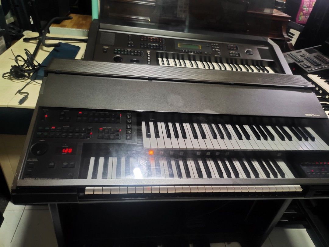 Yamaha Electone EL-37 Electronic Organ (Category: Musical Instruments) located in Quezon City. Submitted by gwace1717 (Listing ID 1415821278, Image 2). Description: - Yamaha Electone EL-37 electronic organ - Features multiple keys and control panels - Includes a display screen - Dark gray finish - In good working condition - Ideal for musicians and music learners.