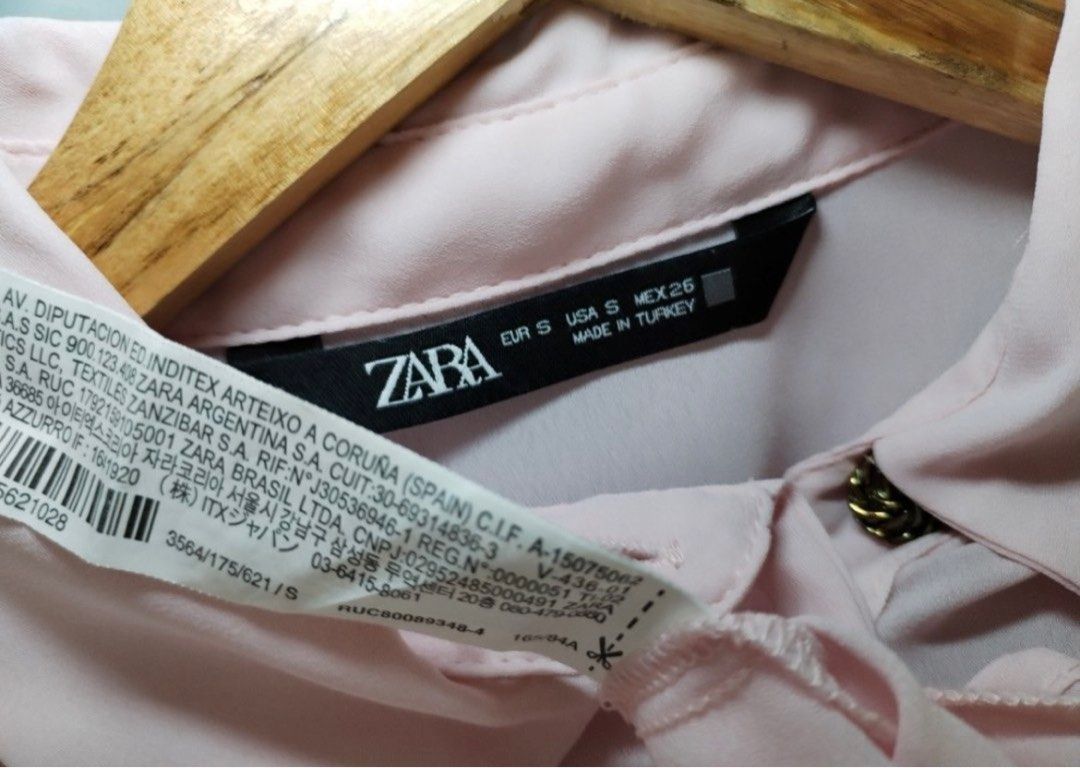 Zara Pink Blouse with Embellishments (Category: Blouses) located in Mandaluyong City. Submitted by jenad19 (Listing ID 1415769302, Image 3). Description: - Zara pink blouse - Size: S to M - Features: Long sleeves with buttoned cuffs - Details: Decorative shoulder embellishments - Design: Classic collar, button-down front .