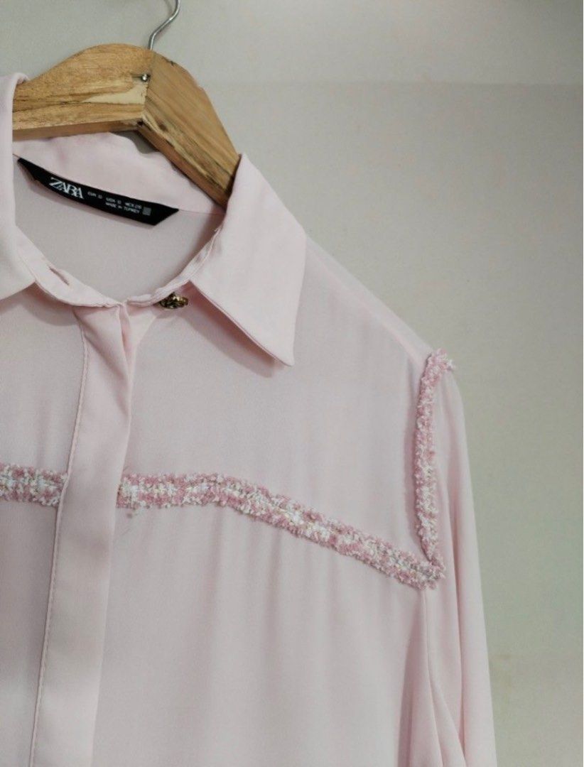 Zara Pink Blouse with Embellishments (Category: Blouses) located in Mandaluyong City. Submitted by jenad19 (Listing ID 1415769302, Image 2). Description: - Zara pink blouse - Size: S to M - Features: Long sleeves with buttoned cuffs - Details: Decorative shoulder embellishments - Design: Classic collar, button-down front .
