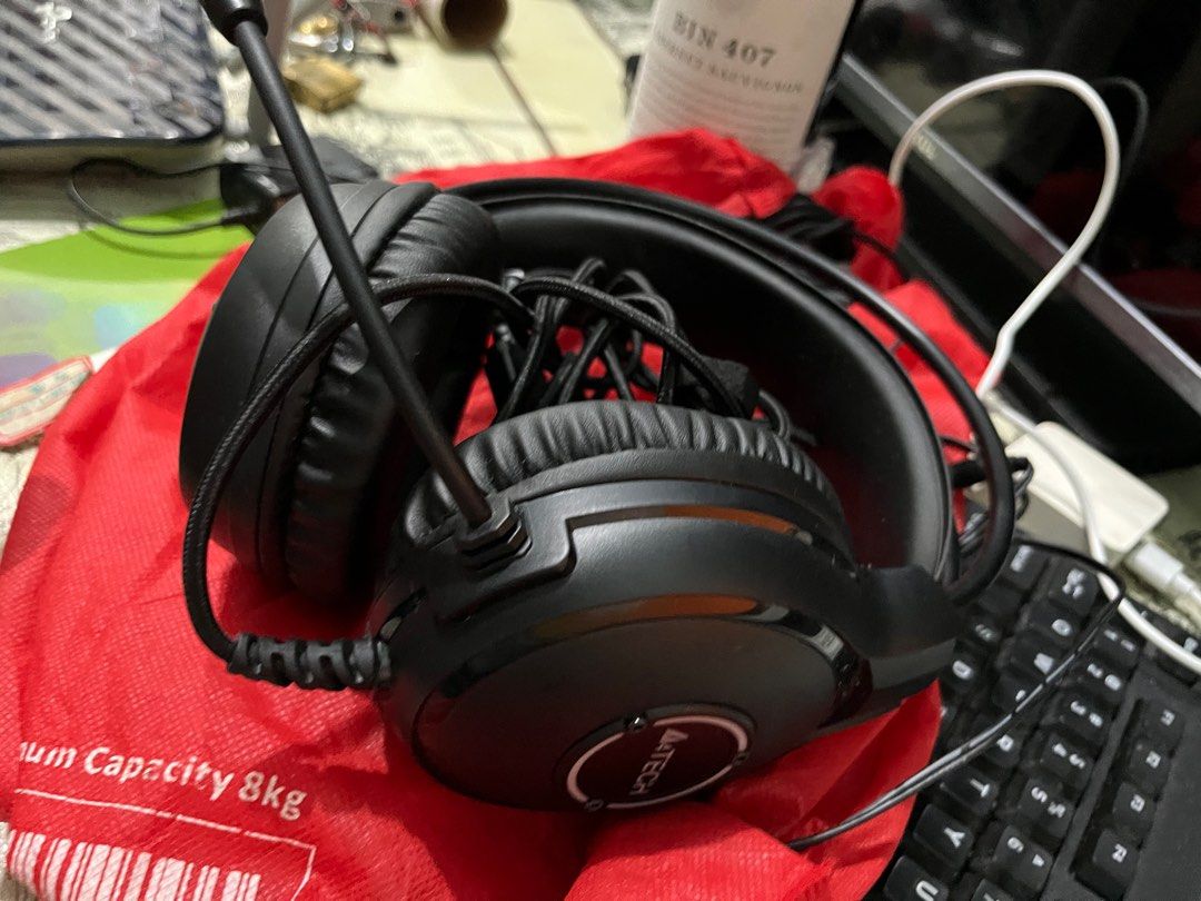 A4TECH Gaming Headset with Microphone (Category: Headphones & Headsets) located in Caloocan City. Submitted by zheligin0932803 (Listing ID 1415995070, Image 2). Description: - A4TECH gaming headset - Black color - Padded headband and earcups for comfort - Flexible, adjustable microphone - Wired connection - A4TECH logo visible.