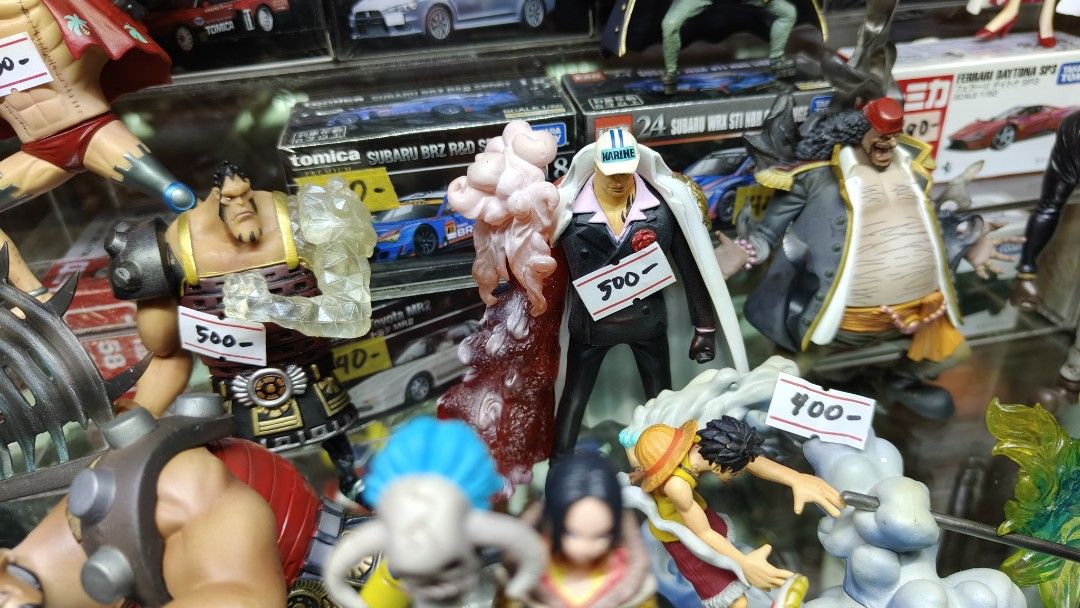 Assorted Tomica Transformers One Piece Luffy, Sanji, Boa Hancock Figures (Category: Figurines & Statues) located in Manila. Submitted by rossinicalabig (Listing ID 1415934607, Image 2). Description: 200-2000 Pesos each. Assorted Japan Surplus Toys. Collectible One Piece figures featuring Luffy, Sanji, and Boa Hancock. Each figure is detailed and comes with a base. Perfect for fans of the anime series. Prices are indicated on the figures. Great fo