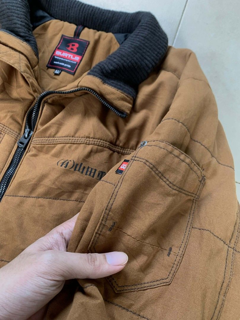 Burtle Brown Jacket (Category: Coats, Jackets and Outerwear) located in Quezon City. Submitted by chic.on.a.dime (Listing ID 1415863475, Image 3). Description: - Brown Burtle jacket - Black collar - Size: L-XL - Zipper closure - Multiple pockets (chest, sides and inside) - Quilted design - Black lining - Japanese text on sleeve - Japanese workwear jacket - Heavy jacket NOTE: MANAGE YOUR EXPECTATIONS ‼️📢 - color may vary due to lighting - please 