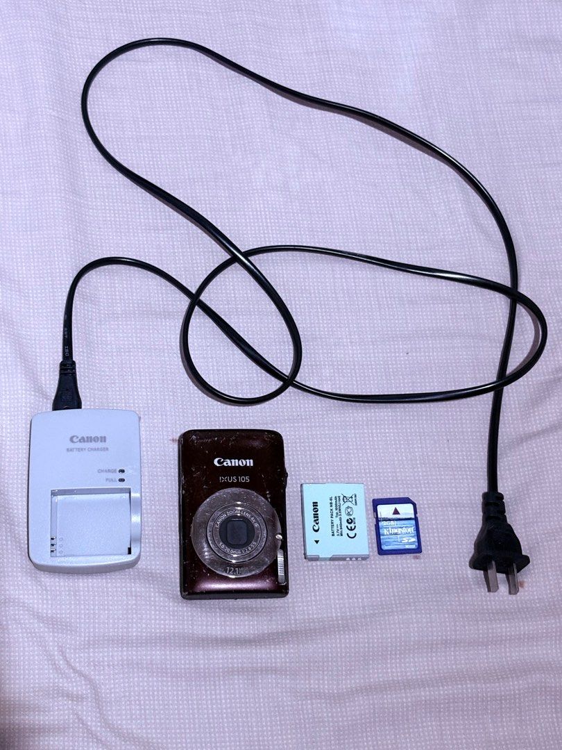 Canon IXUS 105 Digital Camera (Category: Cameras) located in Manila. Submitted by gabriellea00749 (Listing ID 1415863732, Image 1). Description: Canon IXUS 105 (brown) VVV nice!! I love the brown color! Issue: Vignette LCD however, does not affect the output Scratches on the external body (seen on the pics) and little dent on the side Walang rubber sa battery door kaya sometimes kailangan pa tanggalin pero okay naman din after Inclusion: Unit its