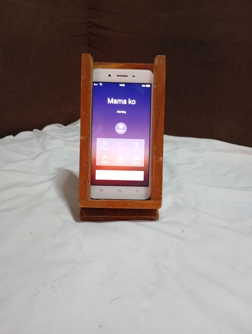 Cellphone stand (Category: Mounts & Holders) located in Quezon City. Submitted by obemistic27 (Listing ID 1415900817, Image 1). Description: This was created by my indigenous carpenter father, I could say this is his invention, I hope my future client would enjoy this. Made of wood and experience : ).