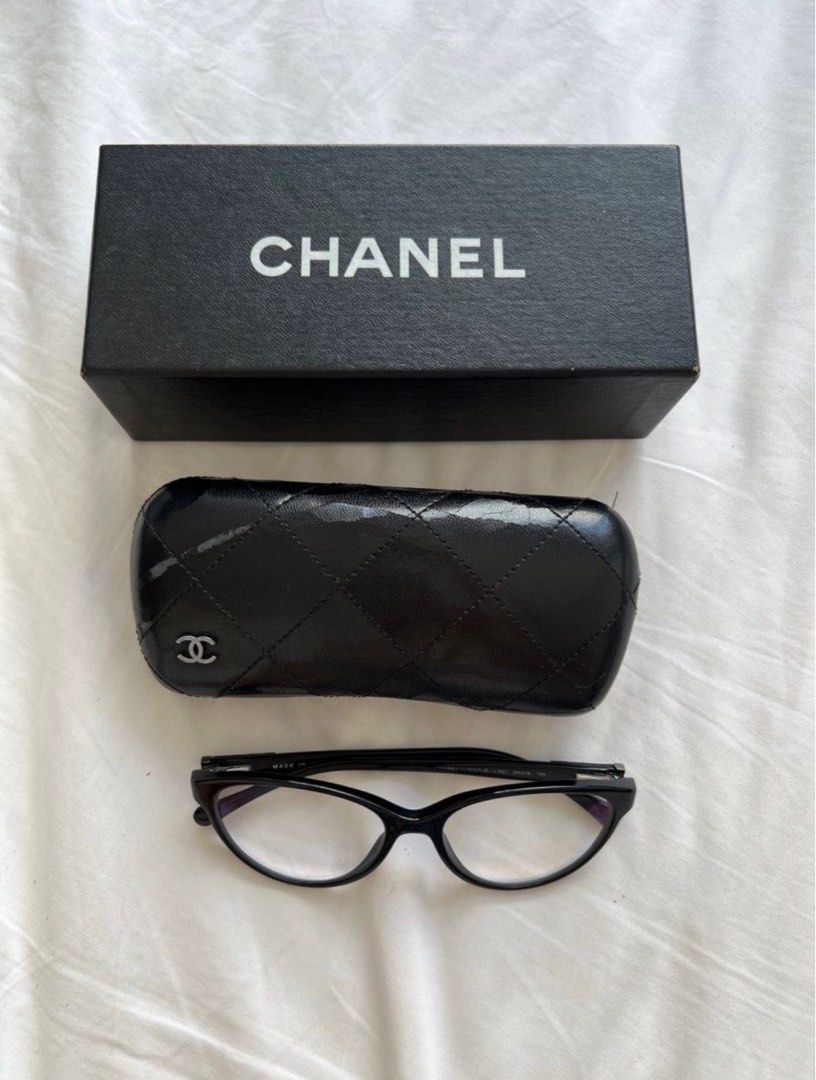 Chanel Eyeglasses (Category: Luxury Accessories) located in Taguig. Submitted by Sweettooth888 (Listing ID 1415994424, Image 1). Description: Chanel Eyeglasses Comes with case and box. *The outside of the case, as it is not leather, has developed storage damages over time. But the inside of the case is still the same. *You may see it personally, just message me. Serious buyers only please. Thank you. .