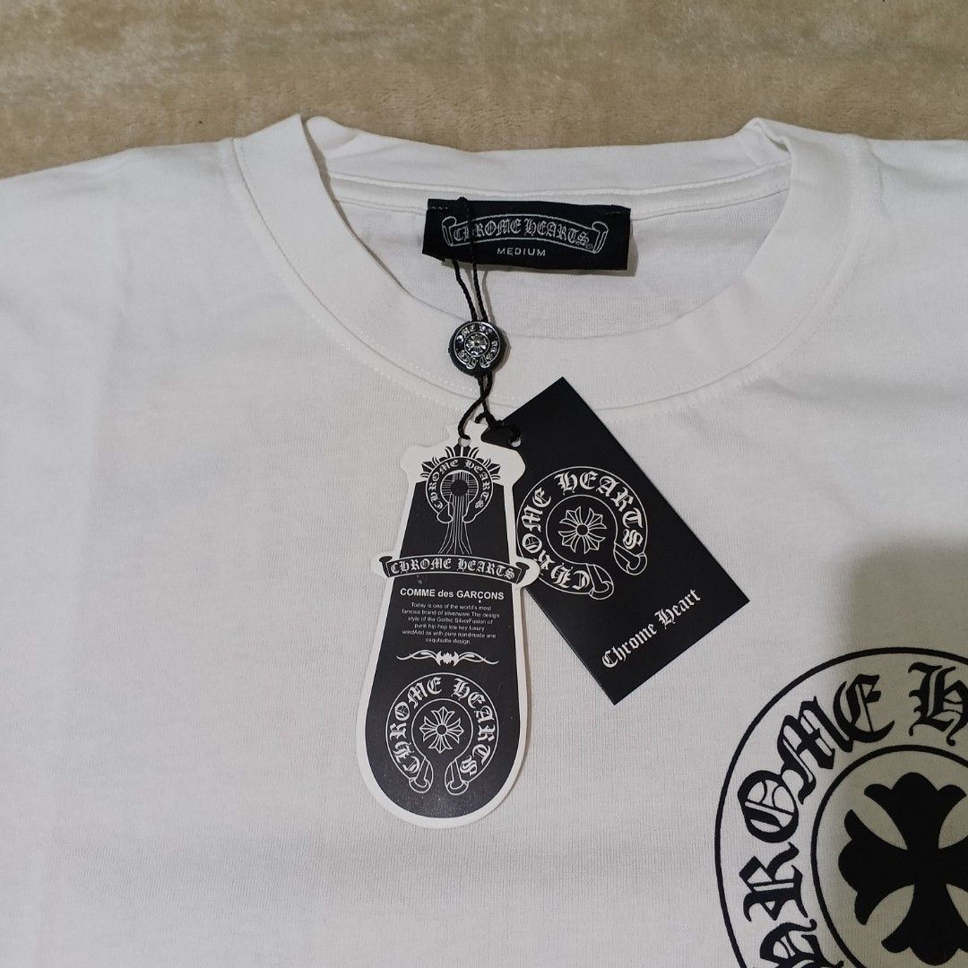 Chrome Hearts | authentic bnew overrunsss (Category: Tshirts & Polo Shirts ) located in Bulacan. Submitted by retroflair.444 (Listing ID 1415934121, Image 3). Description: - Brand new Chrome Hearts T-shirt - Size: Medium - Made in USA - Features a front logo and a design on the back - Classic crew neck and short sleeves - With tags attached.