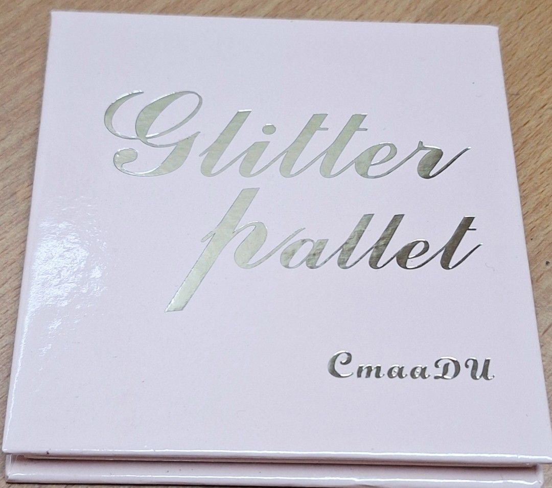 CmaaDU Glitter Palette (Category: Makeup) located in Makati City. Submitted by rory88 (Listing ID 1415950567, Image 2). Description: - CmaaDU Glitter Palette with 9 dazzling shades. - Includes shades: Run to You, Whisper, Love Song, Truly, Afterglow, Romantic, Soulmate, Ride or Die, and Forever. - Perfect for adding sparkle to your eye makeup. - Compact and travel-friendly..
