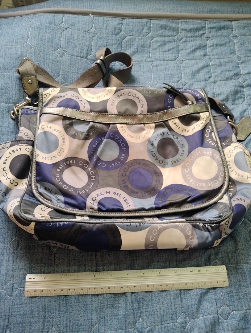 Coach Messenger Bag (Category: Luxury Bags & Wallets) located in Manila. Submitted by dcsago (Listing ID 1415876549, Image 2). Description: Authentic Coach Crossbody / Messenger Bag Stylish and lightweight nylon bag with eye-catching Coach est. 1941 circular logo print. Features leather trim, adjustable shoulder strap, and multiple pockets for everyday essentials. Perfect for casual outings, travel, or daily use. ✔ Clean interior ✔ Durable & func