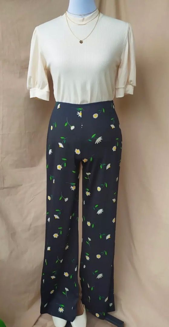 Diasy Floral Print flowy Pants (Category: Other Bottoms) located in Makati City. Submitted by maipw (Listing ID 1415864838, Image 1). Description: - Black pants with a delicate daisy print. - comfortable fit. - Lightweight fabric, ideal for warmer climates. - High-waisted with a classic cut. - fits waist 26-27inches -length in 40inches - Versatile for various outfits..