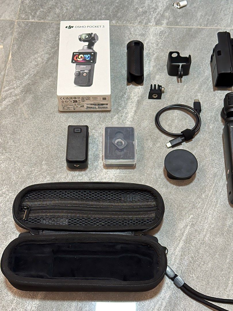 DJI Osmo Pocket 3 with accessories (Category: Cameras) located in Taguig. Submitted by blessthismessph (Listing ID 1415936780, Image 2). Description: DJI Osmo Pocket 3 - Handheld 1-Inch CMOS & 4K/120fps | 2-Inch Rotatable Screen What’s included in the Standard Combo: - Osmo Pocket 3 - Osmo Pocket 3 Handle with 1/4” Thread - Wrist Strap - Osmo Pocket 3 Cover - Type C Charger What I bought as additional accessories which are ALL INCLUDED 2 in 1 Set