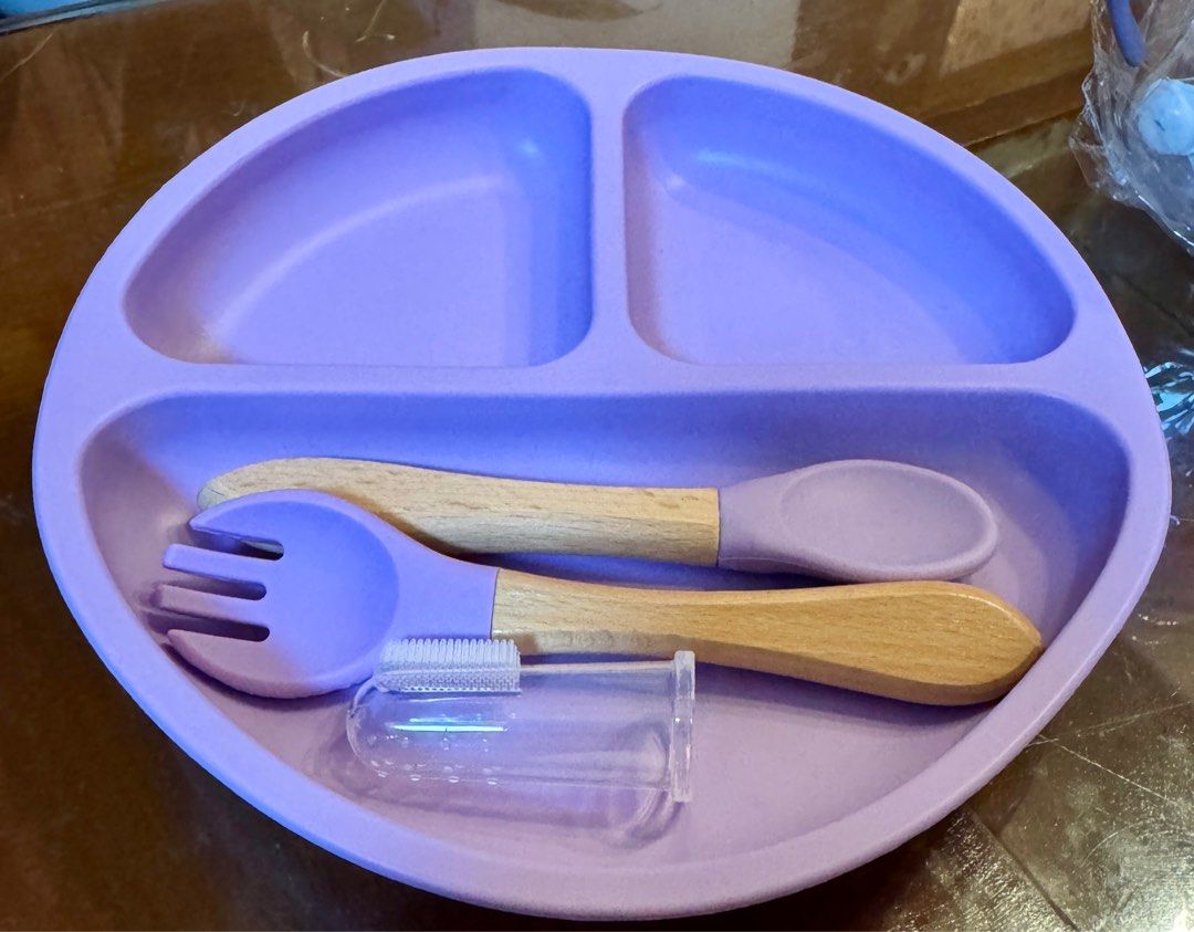 Feeding Set with Bib and Sippy Cup (Category: Weaning & Toddler Feeding) located in Quezon City. Submitted by kryshnanzyanna (Listing ID 1416008775, Image 2). Description: - Complete baby feeding set - Includes: divided plate, spoon, fork, finger toothbrush, silicone bib, and sippy cup - Soft purple color - Sippy cup features a cute bunny design - Perfect for introducing solid foods - Makes mealtimes easier.