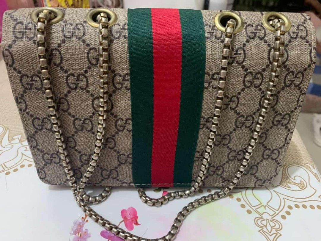 Gucci Shoulder Bag with Chain Strap (Category: Luxury Bags & Wallets) located in Manila. Submitted by aisekura (Listing ID 1415931312, Image 2). Description: - Gucci shoulder bag - Iconic GG monogram pattern - Chain strap - Flap closure with gold-tone GG logo - Green and red stripe detail - Single interior compartment - Gold-tone hardware - No box - Price negotiable for sure buyer .