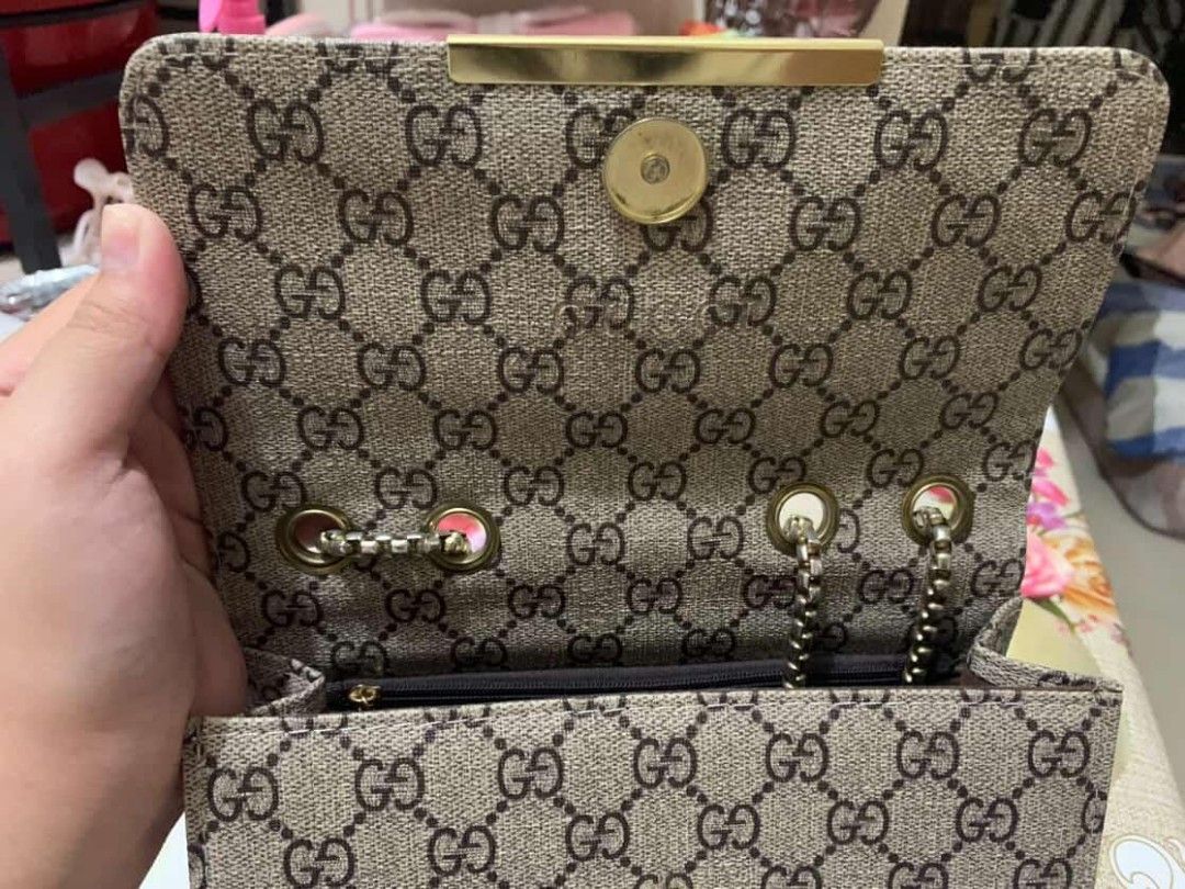Gucci Shoulder Bag with Chain Strap (Category: Luxury Bags & Wallets) located in Manila. Submitted by aisekura (Listing ID 1415931312, Image 3). Description: - Gucci shoulder bag - Iconic GG monogram pattern - Chain strap - Flap closure with gold-tone GG logo - Green and red stripe detail - Single interior compartment - Gold-tone hardware - No box - Price negotiable for sure buyer .