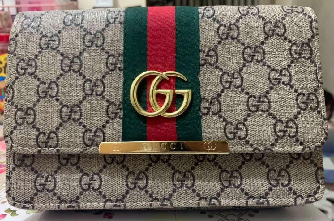 Gucci Shoulder Bag with Chain Strap (Category: Luxury Bags & Wallets) located in Manila. Submitted by aisekura (Listing ID 1415931312, Image 1). Description: - Gucci shoulder bag - Iconic GG monogram pattern - Chain strap - Flap closure with gold-tone GG logo - Green and red stripe detail - Single interior compartment - Gold-tone hardware - No box - Price negotiable for sure buyer .