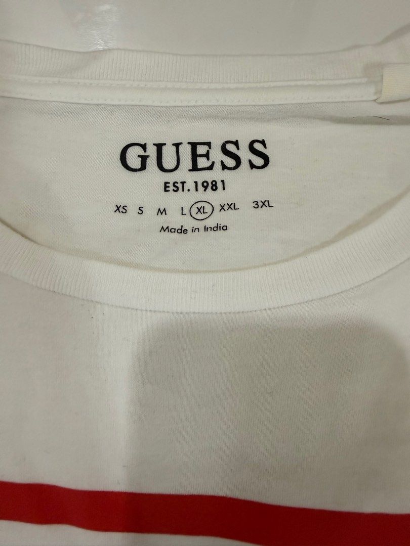 Guess T-shirt XL (Category: Tshirts & Polo Shirts ) located in Cabuyao City. Submitted by allorigz (Listing ID 1415868370, Image 2). Description: - Guess T-shirt - Features iconic red triangle logo - Includes "Guess" logo and "U.S.A. Jeans" text - Size: XL - Made in India - Classic crew neck design.