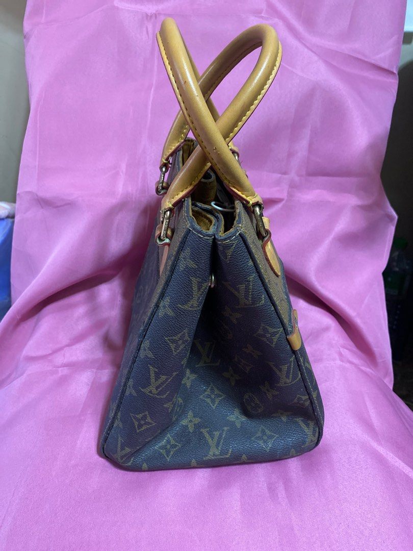 LV Monogram Handbag with Sling (Category: Luxury Bags & Wallets) located in Valenzuela. Submitted by shai.s_finds (Listing ID 1415878218, Image 2). Description: - handbag with sling - Iconic monogram pattern - Detachable shoulder strap - Soft, suede-like interior lining - Structured shape with top handles - Metal hardware - Small interior pocket ‼️broken sling loop (see last pic) .