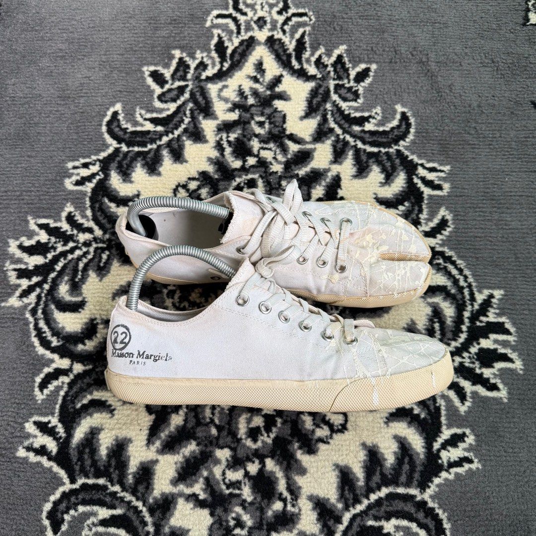 Maison Margiela Paint Splatter Canvas Tabi (Category: Sneakers) located in Quezon City. Submitted by jawnzslayer (Listing ID 1415859725, Image 1). Description: mm tabi white canvas paint splatter no box, pair only size 42 on tag can fit 9-9.5 worn condition.