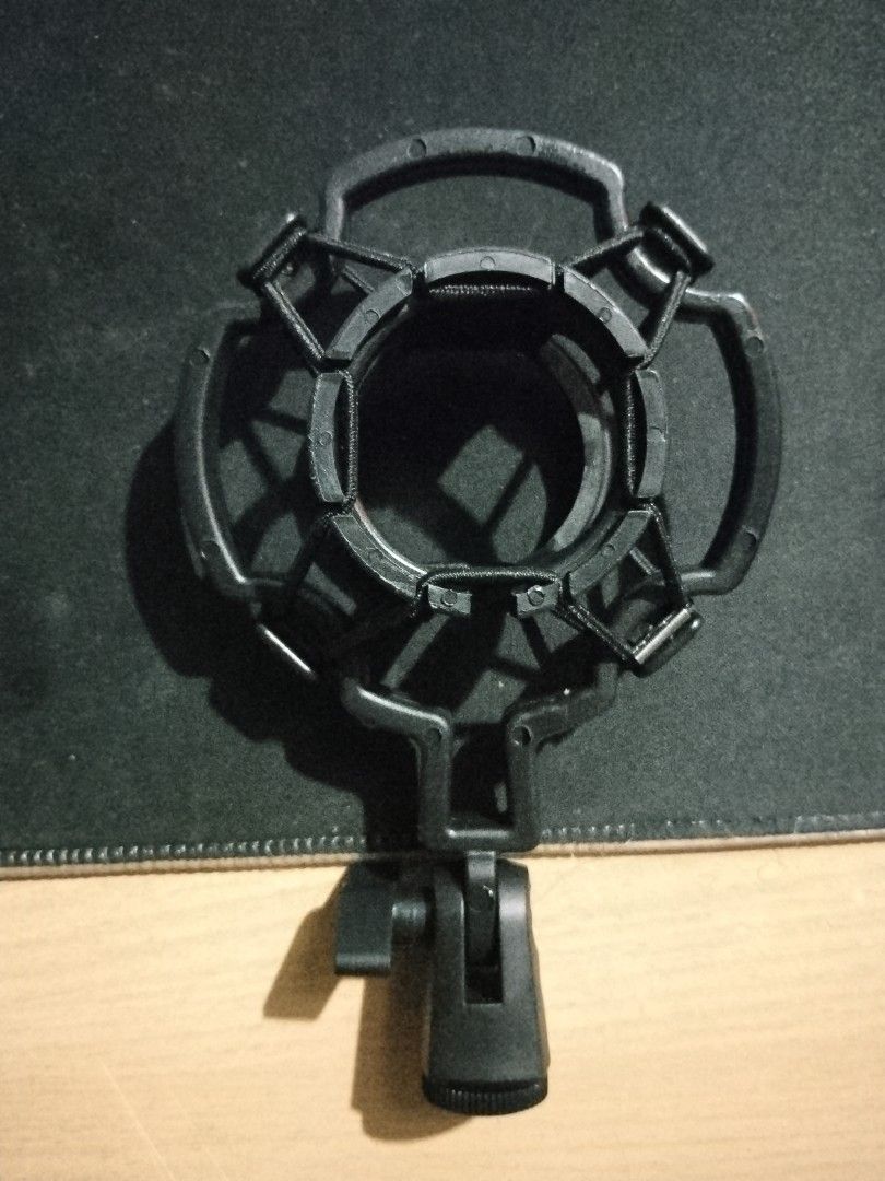 Microphone Shock Mount (Category: Microphones) located in Mandaluyong City. Submitted by eyji569 (Listing ID 1415978125, Image 1). Description: - Brand new never used - Black plastic shock mount - Circular design - Includes mounting bracket - Minimizes vibrations - Reduces unwanted noise - Improves audio quality.