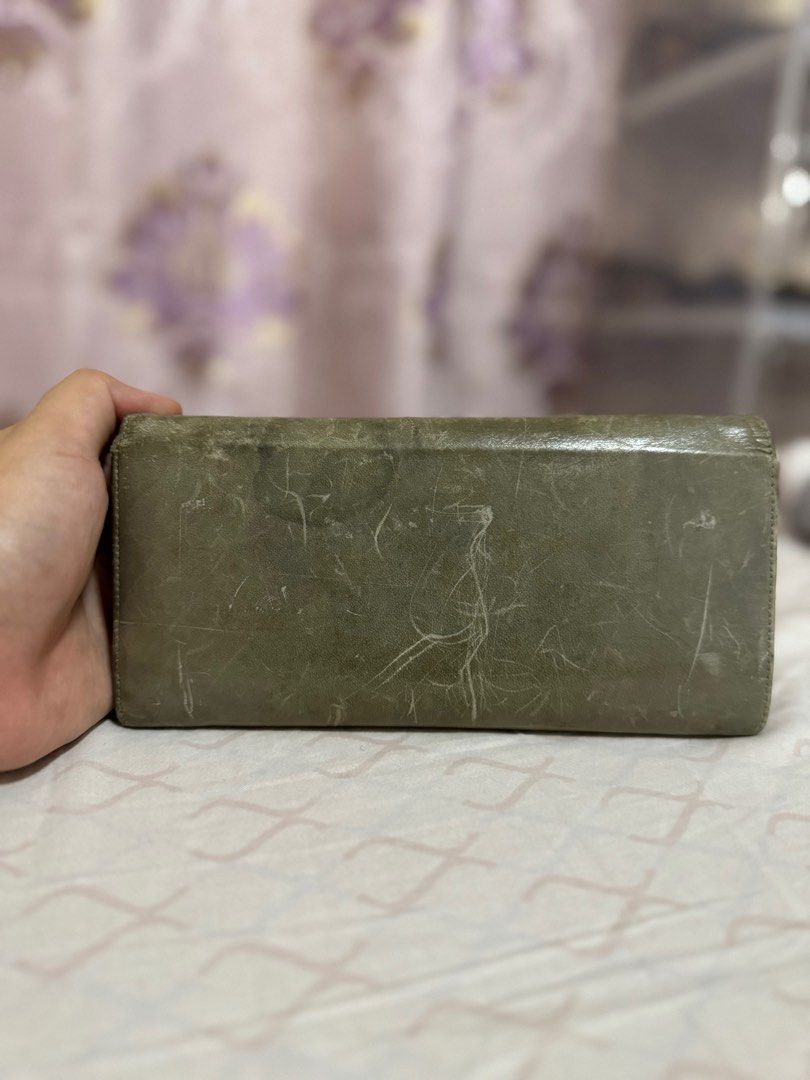 AUTHENTIC Miu Miu Long Wallet (Category: Luxury Bags & Wallets) located in Quezon City. Submitted by onestock2024 (Listing ID 1415956924, Image 3). Description: Authentic Miu Miu long wallet in a green hue. Features a snap closure and multiple card slots. The interior is a lighter shade of pink. Includes a zippered compartment for coins or other small items. 💳Mode of Payment: Gcash, BPI, and Cod 🚚Mode of Delivery: Grab (same day delivery), Lala